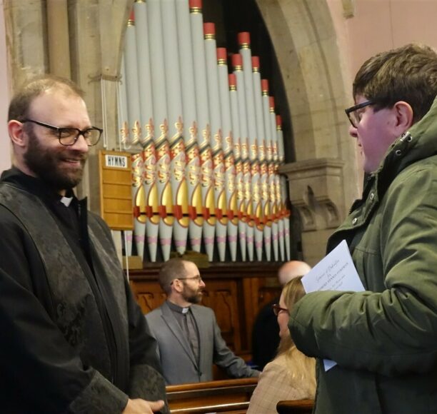 Rev. Robert Foreman speaks to fellow Luther King Student, Simon Peters