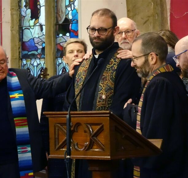 Rev. Rob is ordained with the laying on of hands from his colleagues.